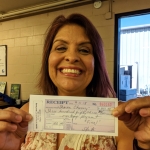 Sharon Chavez with last mortgage payment for Habitat