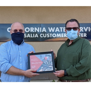 Staff from CalWater holding award